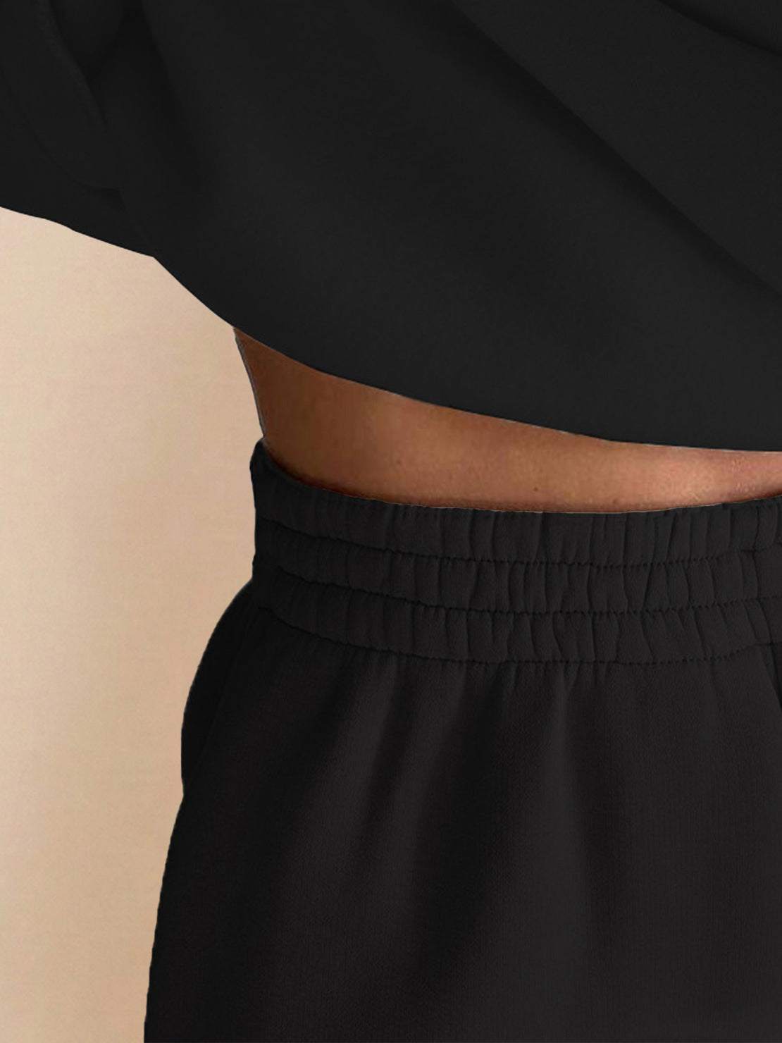 close-up of black Warm & Easy Two-Piece Set showing elastic waistband and soft fabric texture