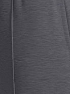 Soft knit wide-leg pants with elastic drawstring waist and side pockets in breathable fabric