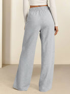 Soft knit wide-leg pants with breathable fabric, elastic drawstring waist, and functional side pockets.