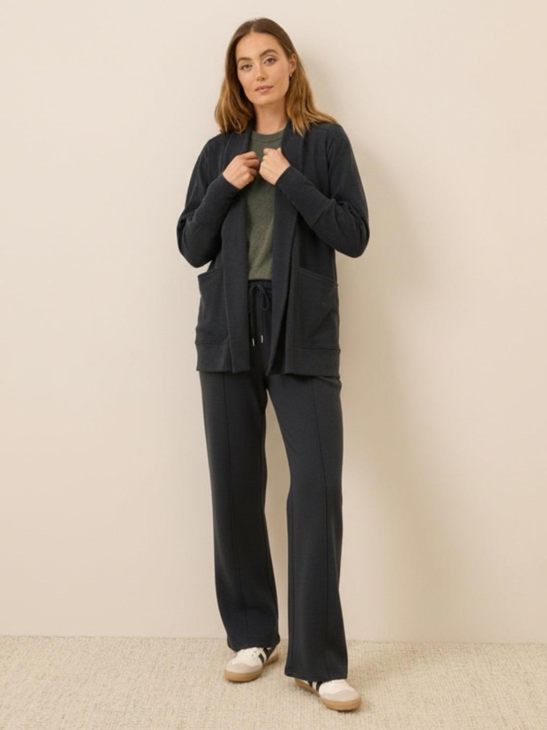 Soft knit wide-leg pants with breathable fabric, elastic drawstring waist, and functional pockets