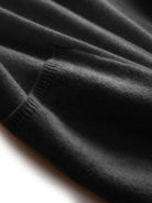 Long Australian Merino Wool cardigan with open front, patch pockets, and ribbed cuffs for fall layering