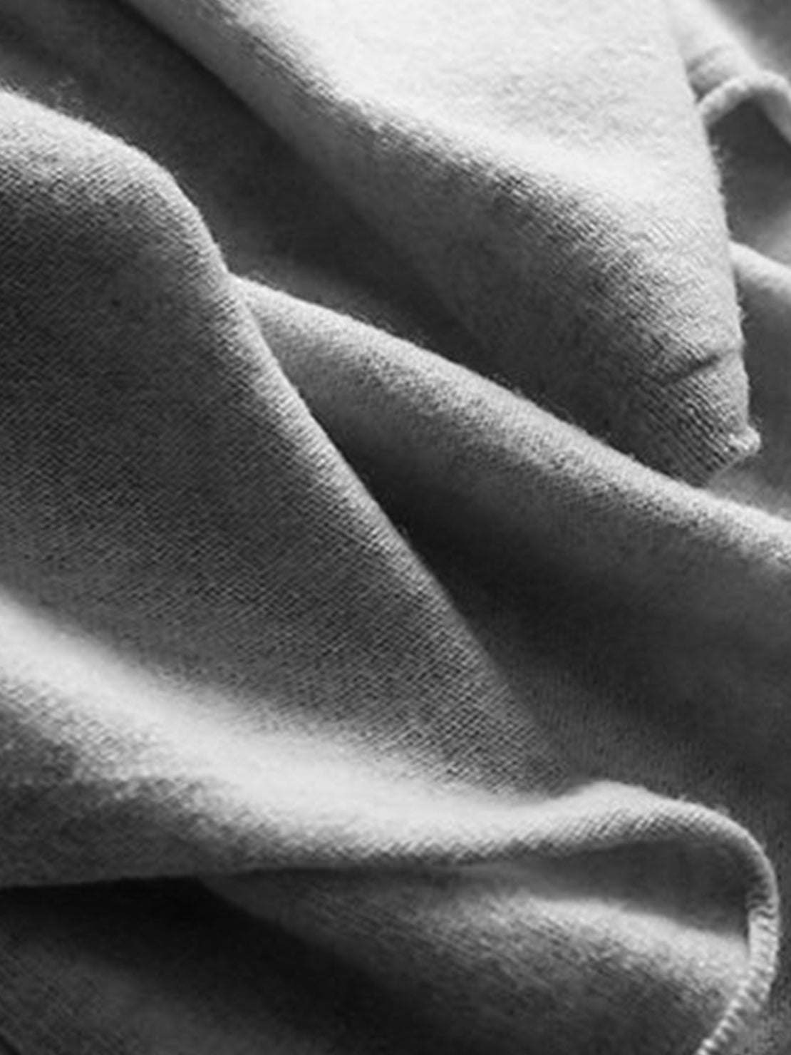 Long open-front Australian Merino Wool cardigan with pockets and ribbed cuffs, ideal for layering in fall and winter