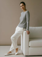 Lightweight 100% cashmere round neck pullover with hip-length cut and long sleeves