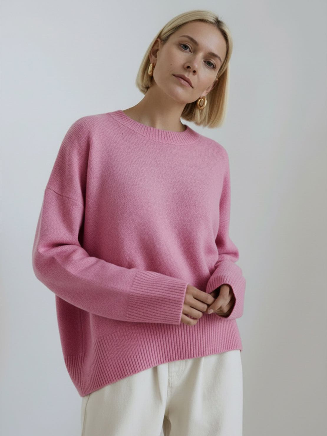 Oversized crew neck knit sweater with drop-shoulder sleeves and relaxed fit in neutral color