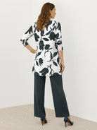 Open-front three-piece co-ord with longline cardigan, wide-leg trousers, and tank top in lightweight knit fabric