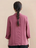 Hip-length cotton-linen blazer with notch lapels, two-button closure, and natural textured fabric