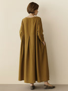 White cotton-linen empire waist maxi dress with 3/4 sleeves and pockets