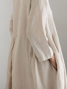 Maxi cotton-linen empire waist dress with 3/4 sleeves and deep pockets