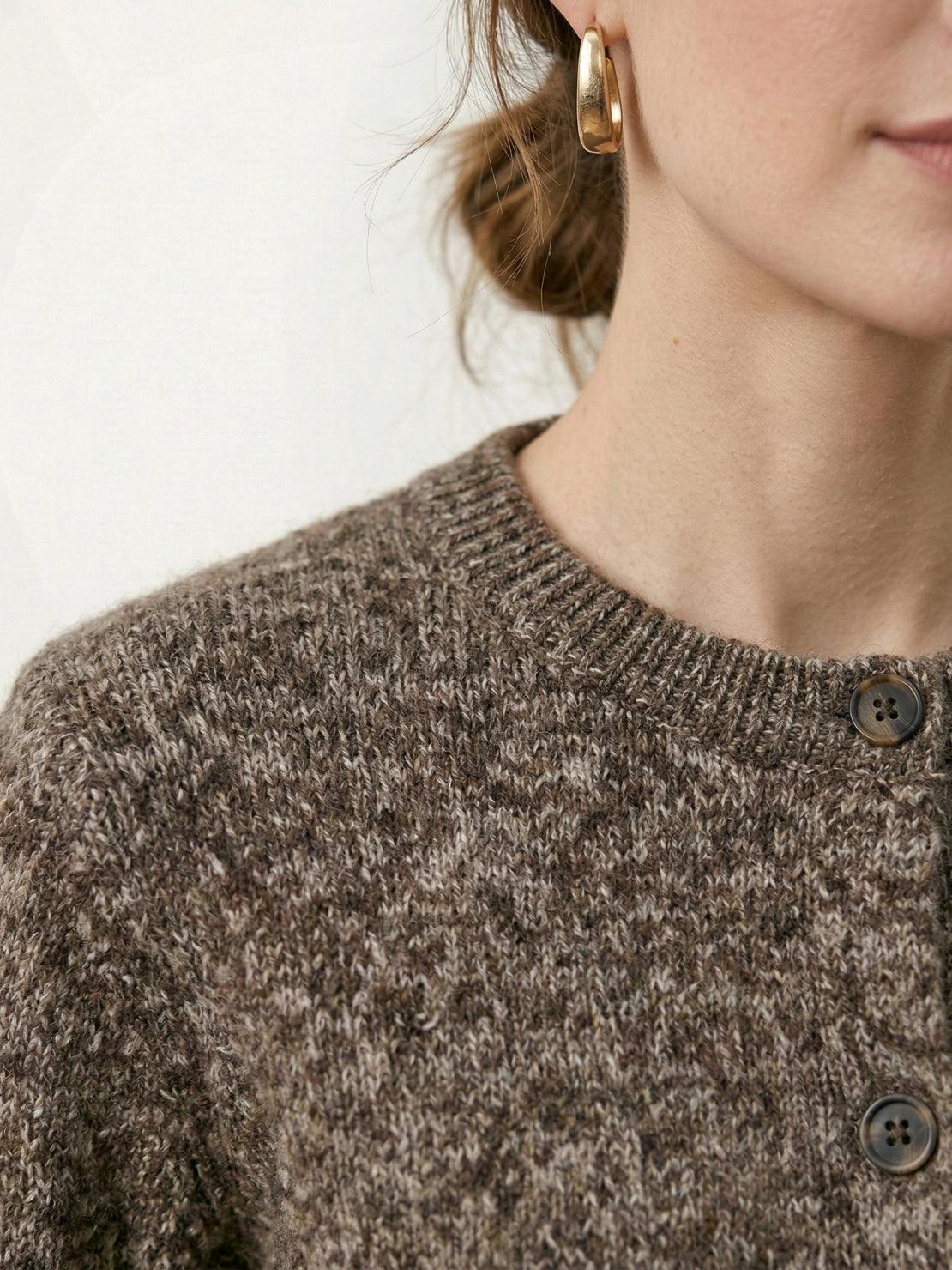 Chunky marled knit merino wool cardigan with contrasting buttons and ribbed cuffs.