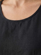 lightweight cotton linen sleeveless maxi dress with round neckline and flowing ankle-length silhouette