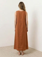 Women wearing a 100% cotton linen sleeveless maxi dress with round neckline and ankle-length relaxed fit