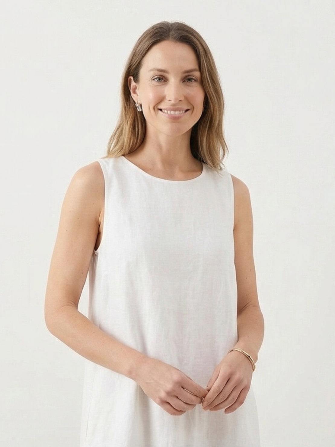 Woman wearing a 100% cotton linen sleeveless maxi dress with round neckline and ankle-length loose fit