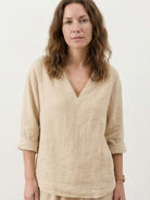 Two-piece cotton linen set with V-neck top and wide-leg pants in breathable fabric