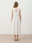 Sleeveless cotton linen pleated midi dress with pintuck bodice and full A-line calf-length skirt