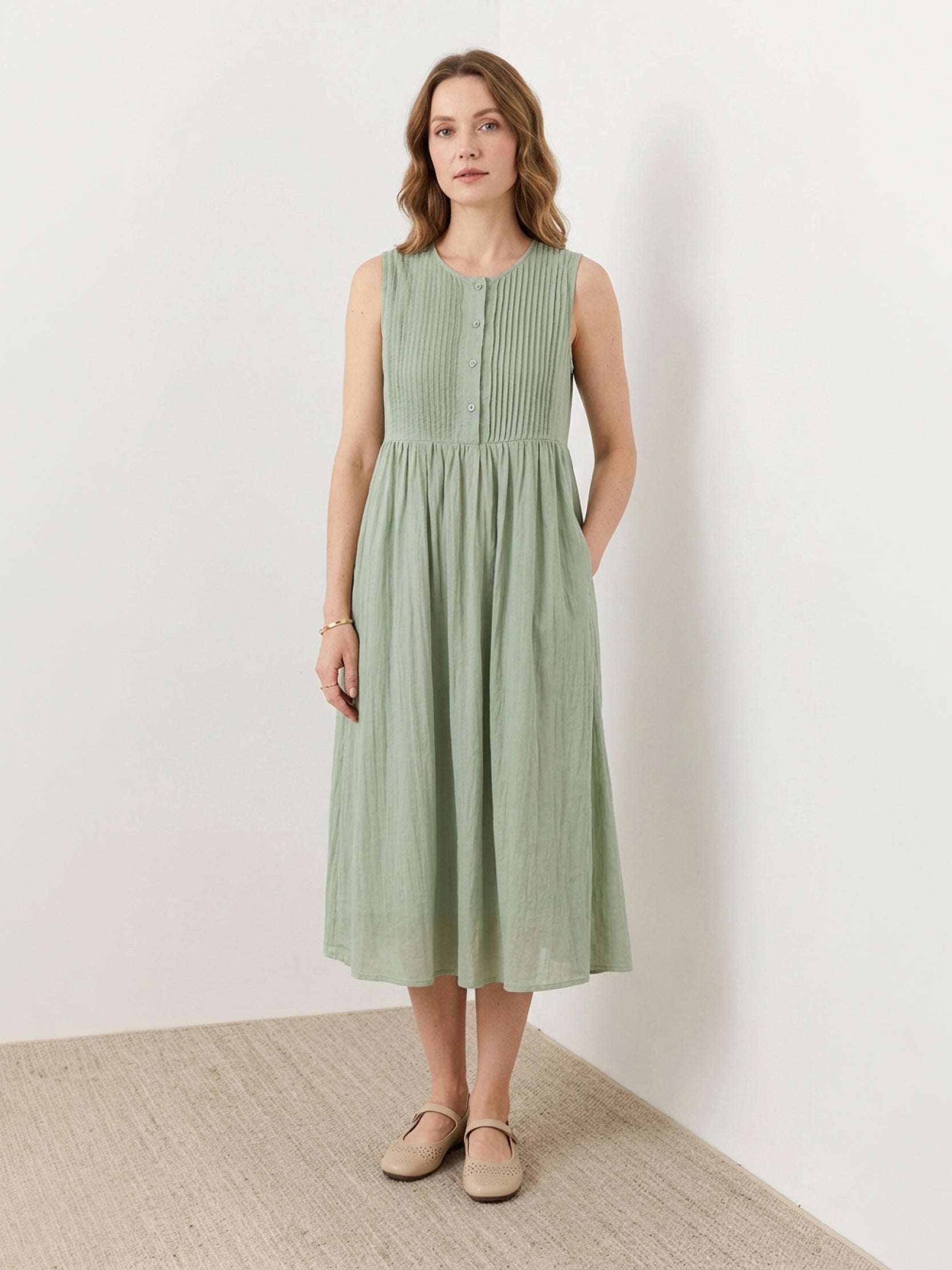 Sleeveless cotton linen pleated midi dress with pintuck bodice and full A-line skirt