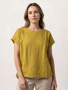 100% linen boxy cap-sleeve top with round neck and hip-length hem in natural linen texture