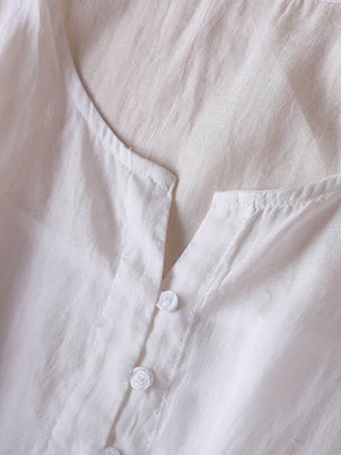 Rusty orange cotton linen dress with embroidered smocked waist and asymmetric midi skirt