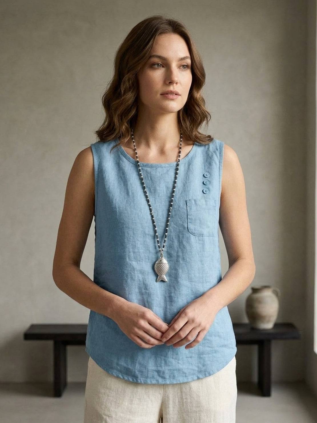 Lightweight sleeveless cotton linen top with chest pocket and curved hem