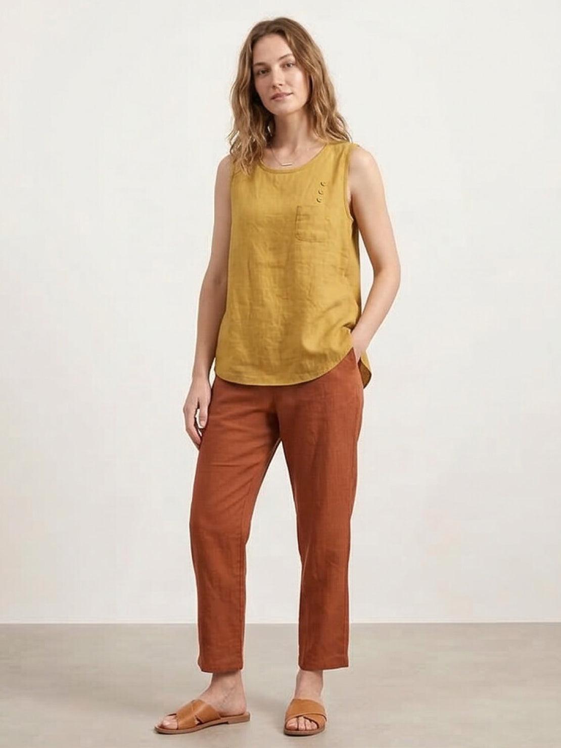 Lightweight sleeveless cotton linen top with relaxed fit, chest pocket, and curved hem