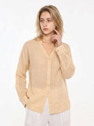Loose fit 100% linen V-neck shirt with long sleeves and button cuffs