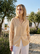 Lightweight 100% linen relaxed fit V-neck shirt with long wide cuffs and curved hem in neutral tones