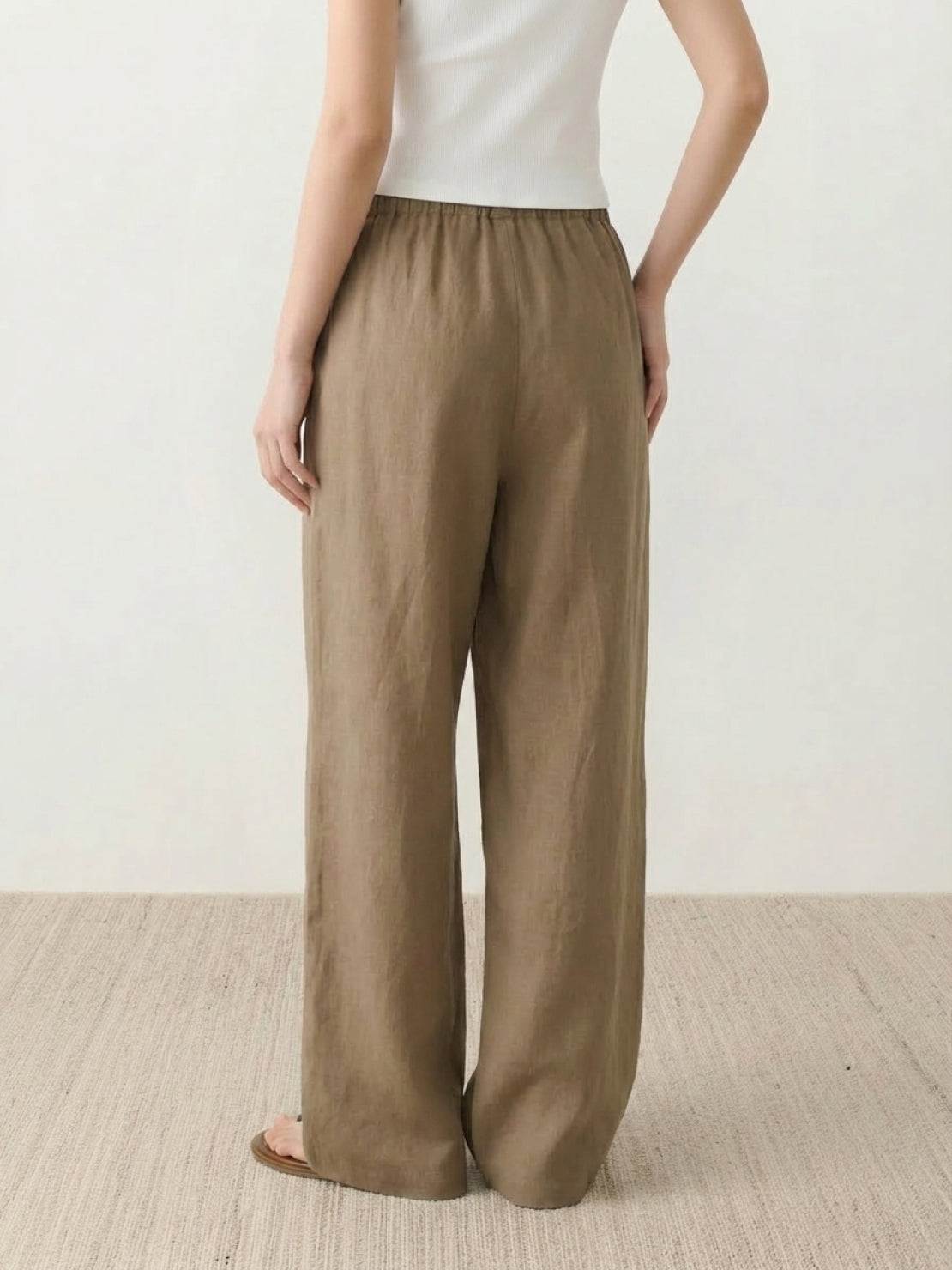 100% linen wide-leg pants with high-rise elastic waist and side pockets