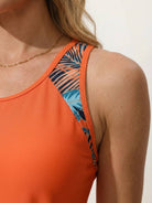 Racerback two-piece tankini set with hip-length tank and mid-thigh tropical print swim shorts with pockets and drawstring waistband