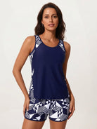 Racerback two-piece tankini set with racerback scoop neck tank top and mid-thigh swim shorts in tropical print