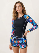 Long-sleeve UV rash guard set with tropical print sleeves and matching swim shorts