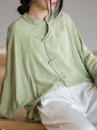 Oversized linen-cotton blouse with batwing sleeves and mandarin collar