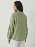 Oversized linen-cotton tang knot blouse with batwing sleeves and asymmetric hem