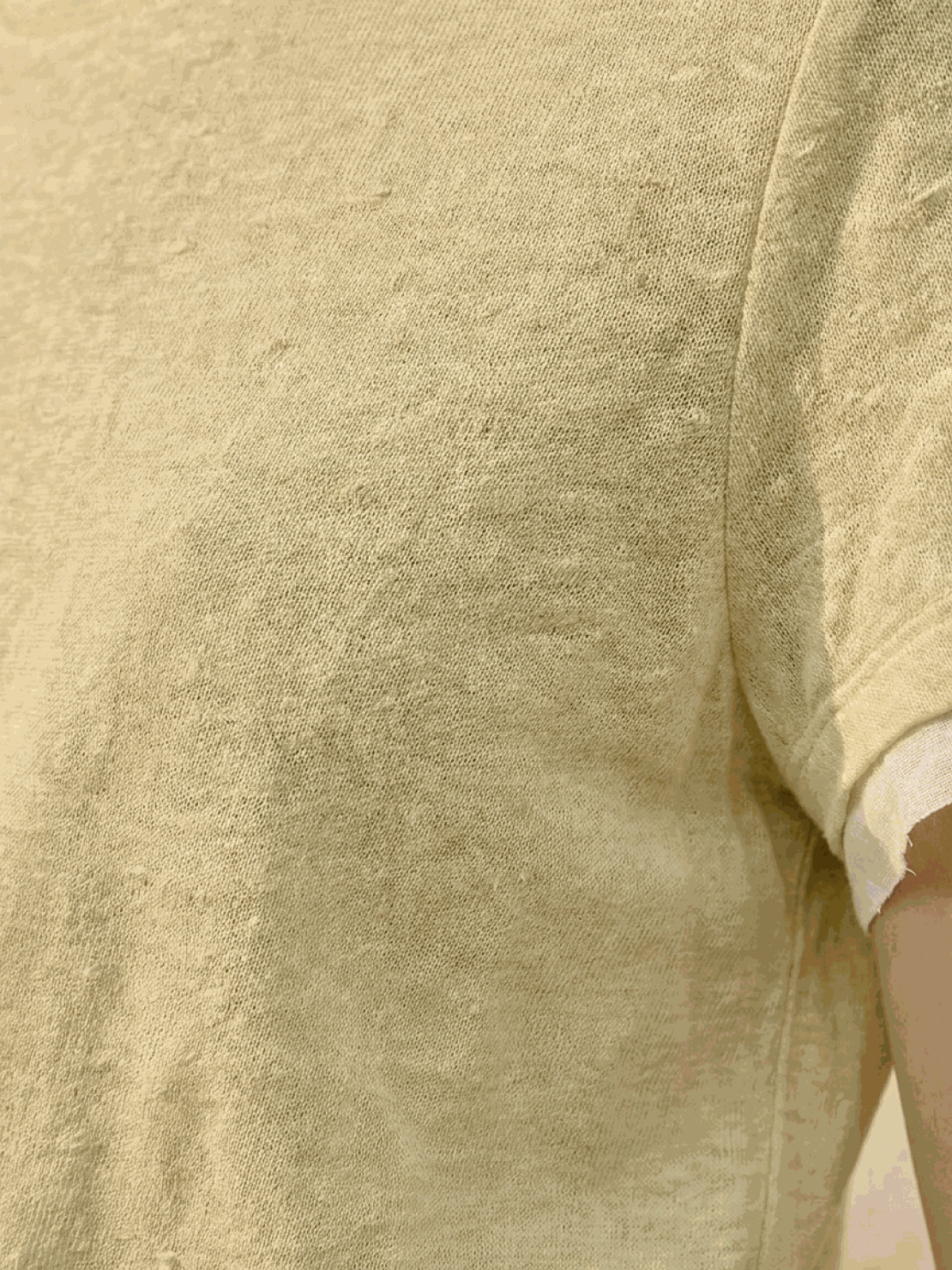 100% linen rolled cuff tee with contrast inner lining, fitted cut, and breathable fabric in white, yellow, and pink colors