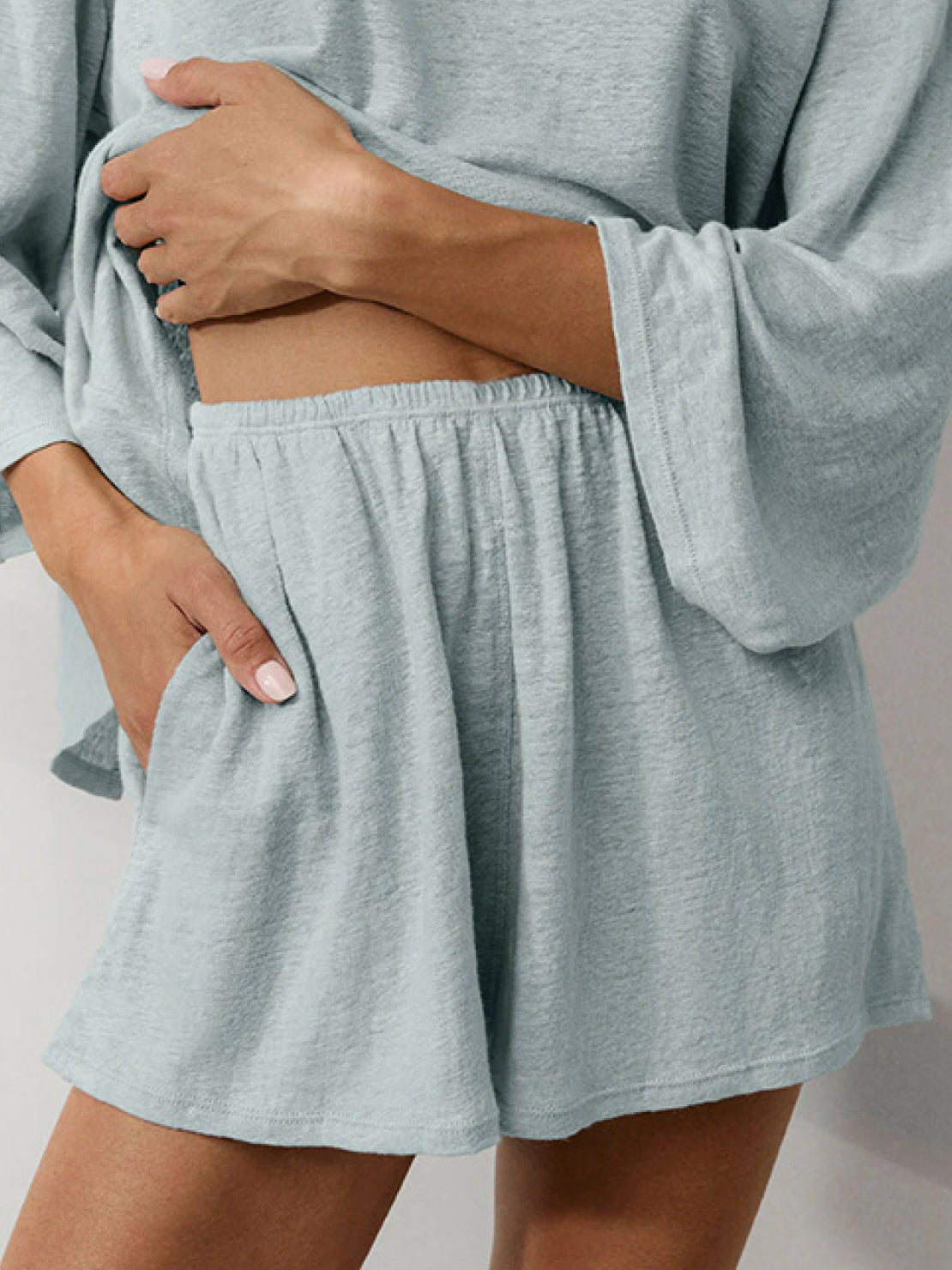 Light blue linen blend lounge set with fitted cropped top and bell sleeves for comfortable spring and summer wear