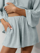 Light blue linen blend lounge set with fitted cropped top and bell sleeves for comfortable spring and summer wear