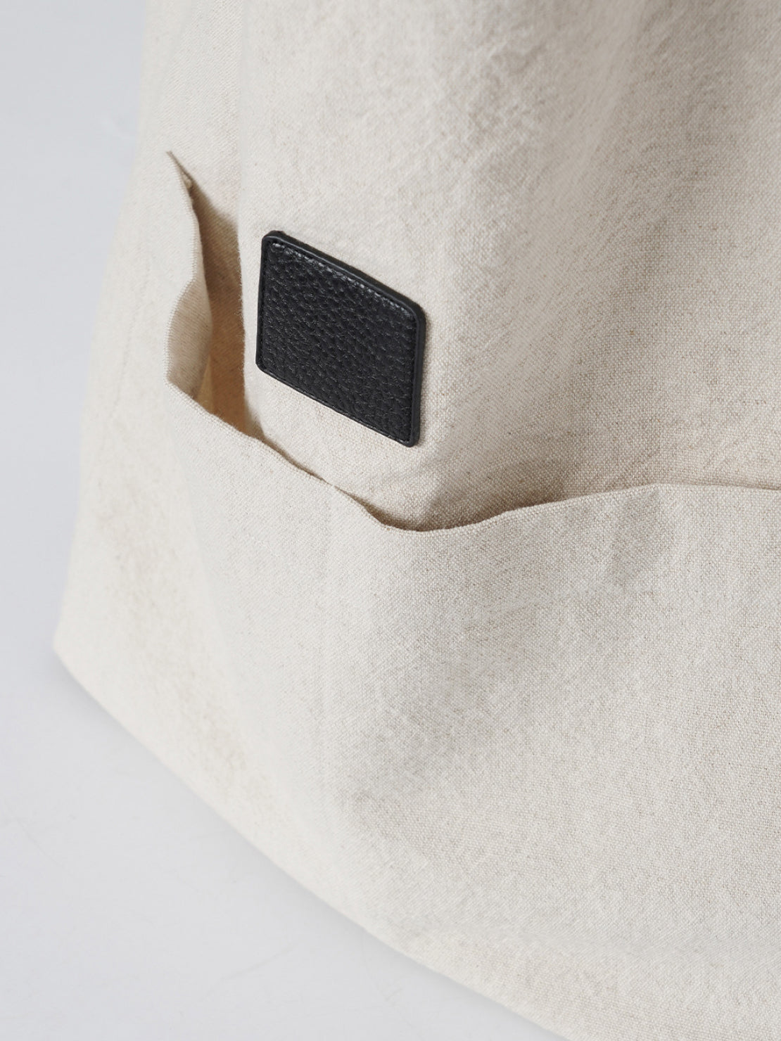 Beige cotton linen canvas shoulder bag with front pocket and comfortable straps for everyday use
