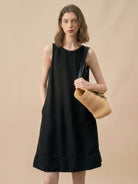 Sleeveless Linen Lyocell blend shift dress with relaxed fit and round neckline in black and white colors