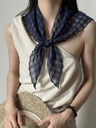 Lightweight 100% linen neck scarf with timeless checkered pattern and natural rolled edges