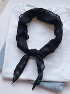 Lightweight 100% linen neck scarf with timeless checkered pattern and versatile styling options