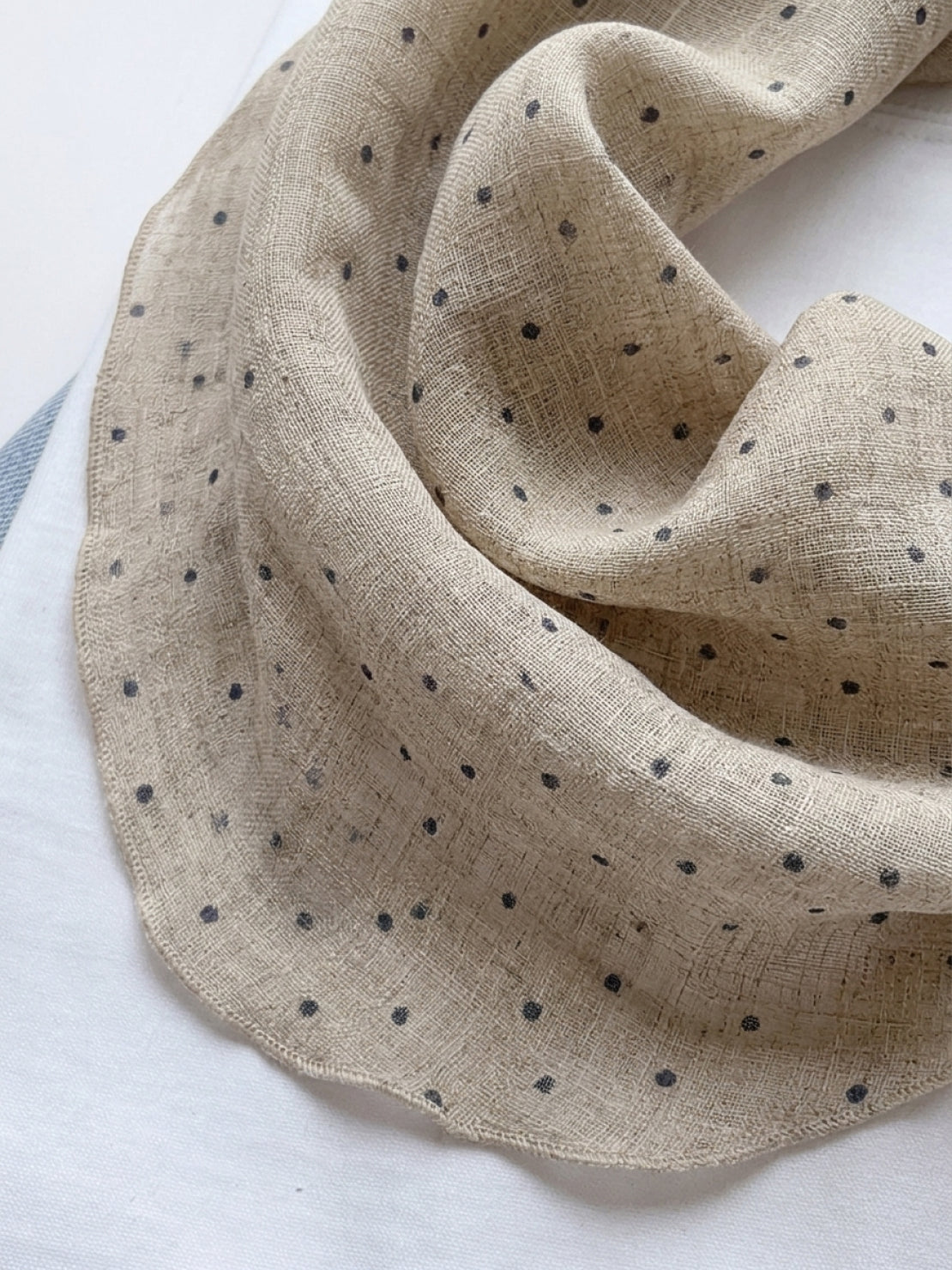 Lightweight 100% linen neck scarf with timeless checkered pattern and natural rolled edges