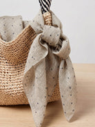 Lightweight 100% linen neck scarf with checkered pattern and natural rolled edges