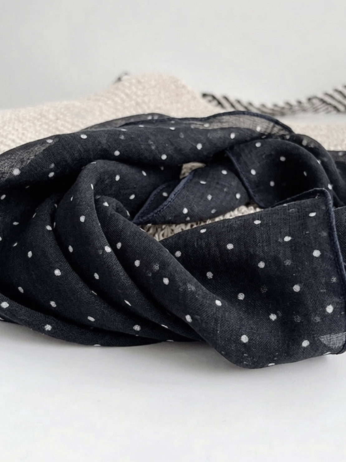 Lightweight 100% linen neck scarf with checkered pattern and natural rolled edges