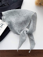 Lightweight 100% linen neck scarf with timeless checkered pattern and natural rolled edges