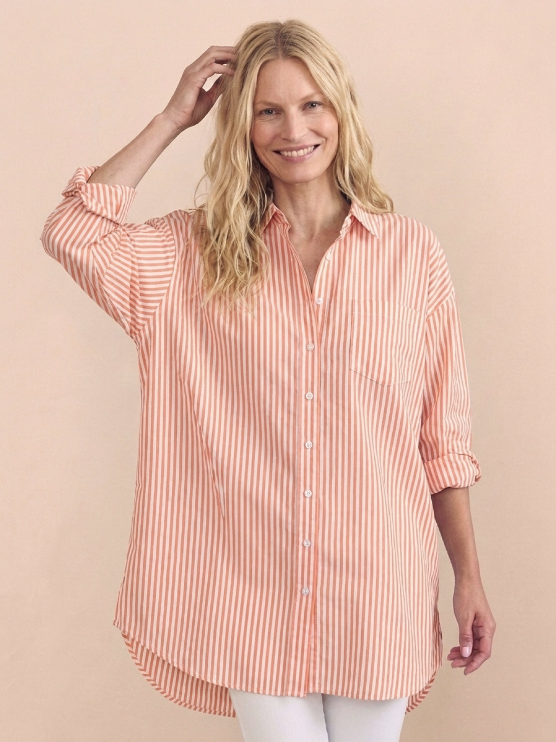 peach oversized linen shirt with back pleat and button-up design