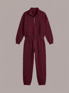 Cotton-blended two-piece tracksuit with zip-front top and straight-leg pants worn by a model