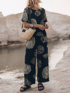 Woman wearing a soft cotton loose fit co-ord set with a relaxed top and wide-leg bottoms