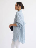 oversized linen shirt in breathable cotton blend with relaxed fit and back pleat details