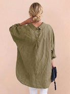 Oversized linen shirt in soft breathable cotton-linen blend with relaxed fit and back pleat details