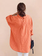 Relaxed oversized 100% cotton linen shirt with dropped shoulders and signature back pleat detail