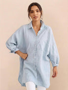 Oversized linen shirt in white cotton-linen blend with relaxed fit and back pleat detailing