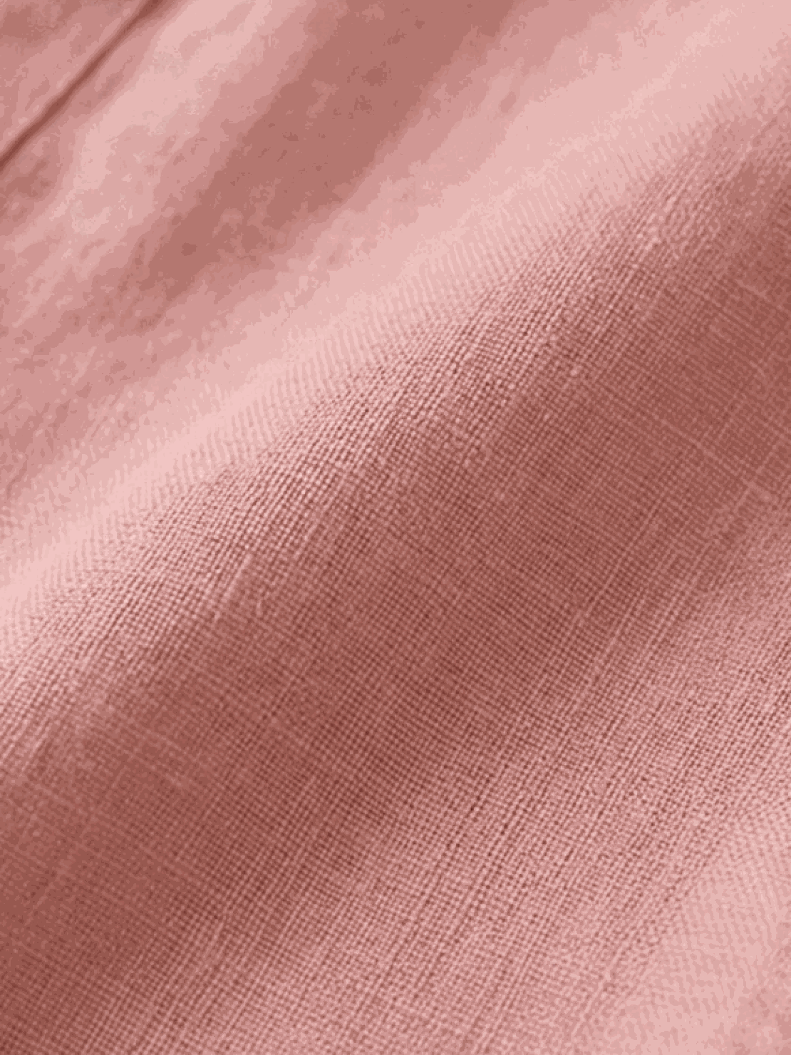 woman wearing pure linen age-defying shirt with button detail in natural light